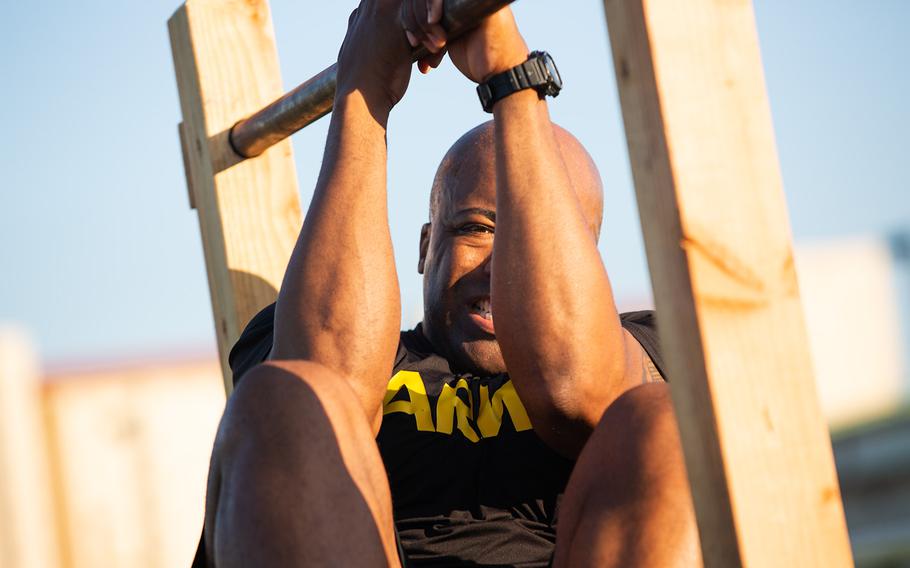 A soldier from the 1st Armored Combat Brigade, 3rd Infantry Division completes a leg tuck during a demo of the new Army Combat Fitness Test at Camp Humphreys, South Korea, Tuesday, July 31, 2018.