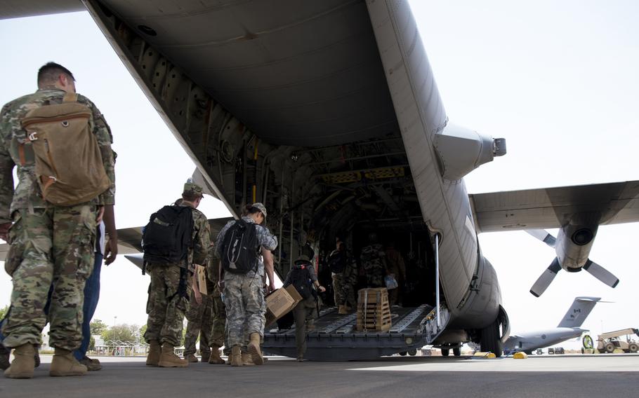 Exercise Flintlock 2018 participants board a C-130H Hercules from the West Virginia Air National Guard, April 11, 2018, at Diori Hamani International Airport, Niger. U.S. Africa Command wants to pull hundreds of troops from Africa and downsize special operations missions.