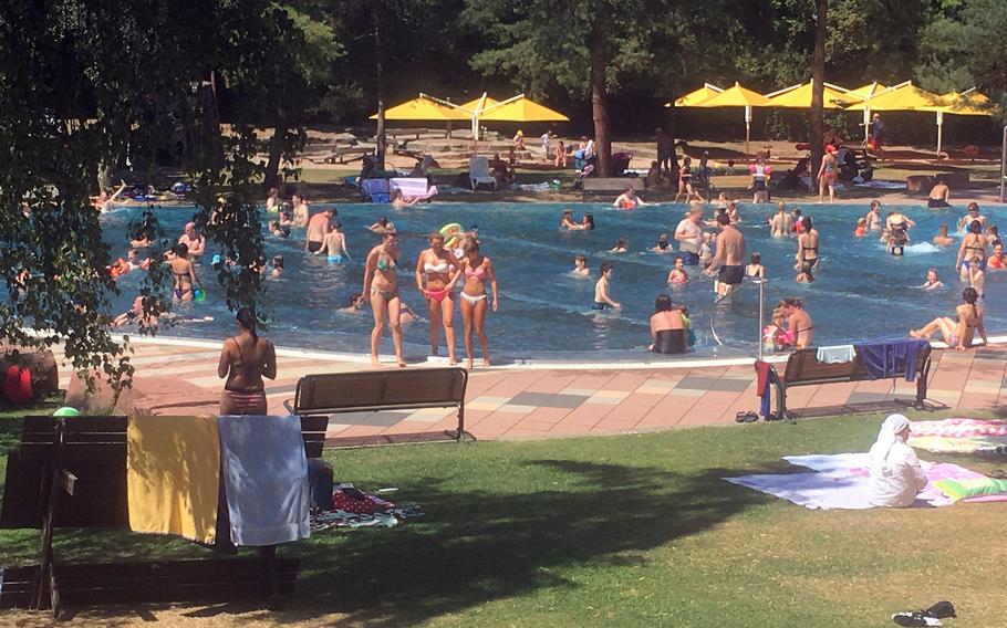 At Hoehenfreibad in Stuttgart, Germany, there are two pools situated in a large greenway next to Killesberg Park. The atmosphere makes for a relaxing place to spend a hot summer day.