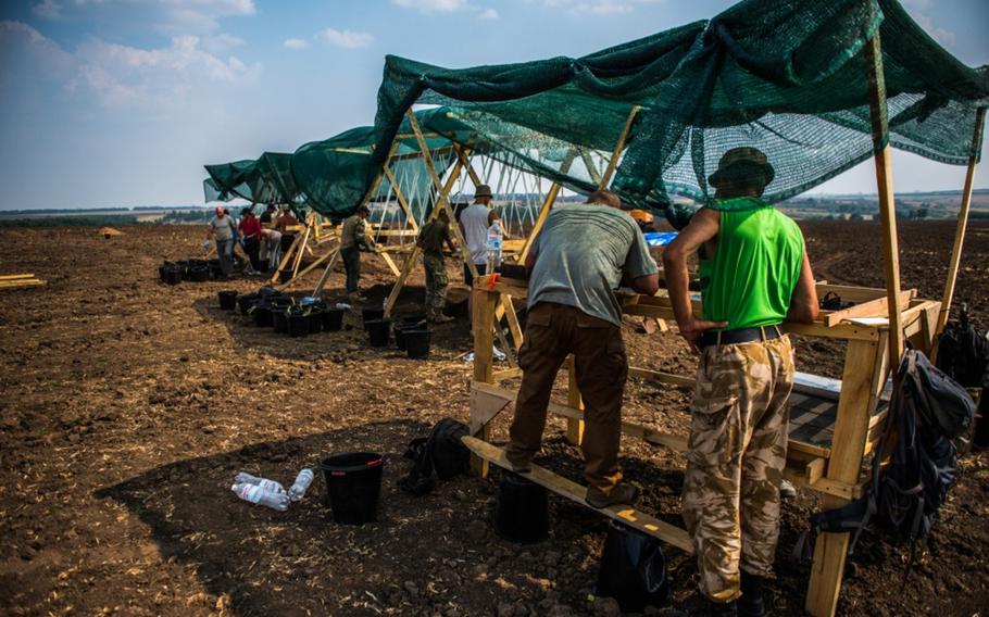 Members of the Defense POW/MIA Accounting Agency conduct recovery operations for a missing American World War II pilot in Novi Troy Any, Ukraine, on July 28, 2016. The mission led to the identification of 2nd Lt. John D. Mumford of St. Petersburg, Fla.