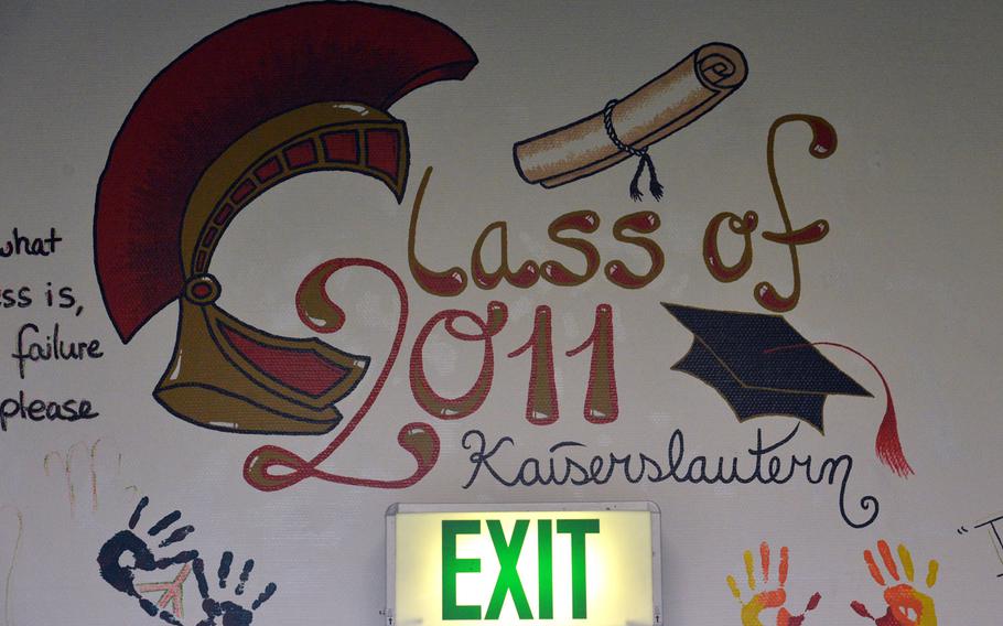 Artwork done by students of Kaiserslautern High School's class of 2011 adorns a wall above an exit in the old school building. For the first time in more than 65 years, no high school students will walk the hallways of the building. A new school is set to open at the end of August.