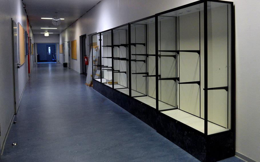 The trophy cases are empty in a hall of the old Kaiserslautern High School building. A new high school will open at the beginning of the new school year, at the end of August, and the trophies will be on display there.
