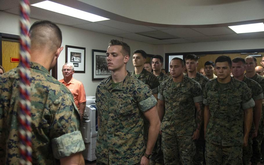 Lance Cpl. Dillon Bennett, machine gunner, 3rd Battalion, 7th Marine Regiment, receives a Purple Heart from Col. Kyle B. Ellison, commanding officer, 7th Marine Regiment, at 7th Marines' Headquarters aboard the Marine Corps Air Ground Combat Center, Twentynine Palms, Calif., July 27, 2018.