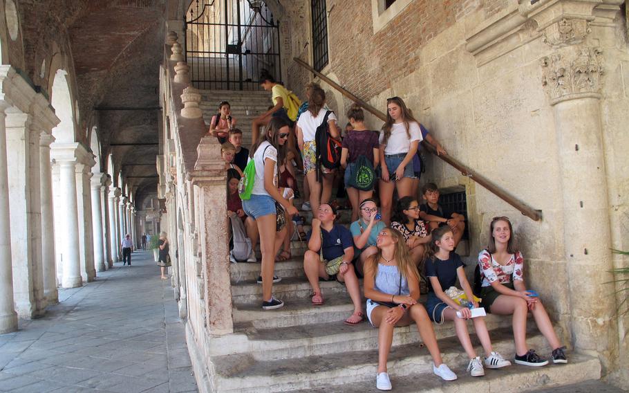 A group of American teens gather on the steps of Vicenza's Basilica Palladiana during one of several city tours provided each summer by U.S. Army Garrison Italy for newly arrived middle- and high-school students.