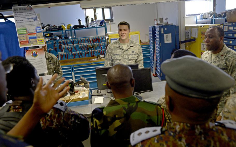Senior Airman Robert Campos, 86th Aircraft Maintenance Squadron, briefs military members from seven African countries during the African Partnership flight at Ramstein Air Base, Germany, Tuesday, Aug. 7, 2018. The weeklong engagement is designed to build relationships and focus on force development.