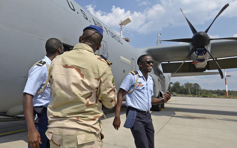 Military members from African countries are shown next to a C-130 during the African Partnership flight at Ramstein Air Base, Germany, on Tuesday, Aug. 7, 2018. The weeklong engagement focuses on force development.