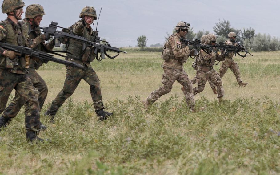 U.S. Army and German soldiers advance during an assault training mission at the Vaziani Training Area, Georgia on Aug. 1, 2018. Noble Partner18 incorporates units from 13 countries, contributing to a stable and secure environment in the Black Sea region.