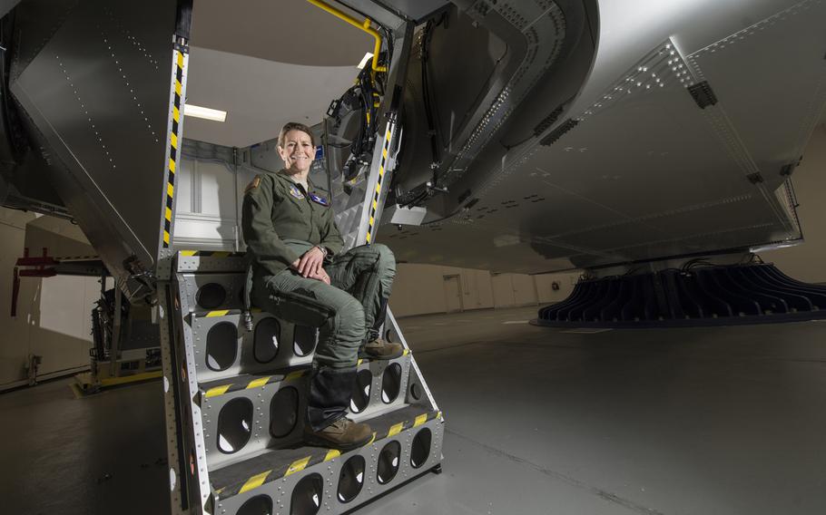 Col. Kathryn Hughes, a pilot-physician and director, Human Systems Integration, 711th Human Performance Wing, sits on the stairs of a centrifuge at Wright-Patterson Air Force Base, Ohio, April 22, 2016. Hughes, an A-10 Thunderbolt II pilot, was instrumental in the integration of the full-coverage G-suit into the Air Force inventory.