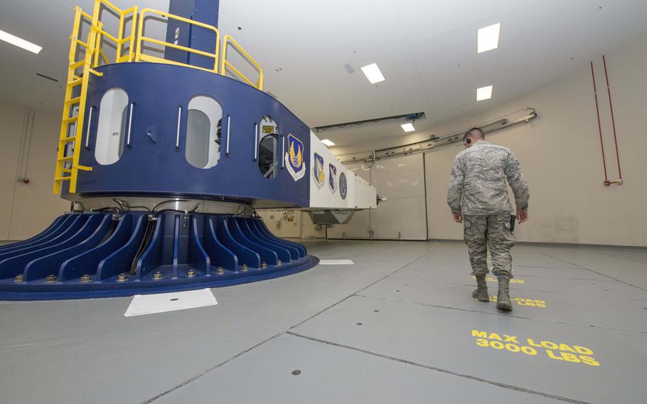 U.S. Air Force Senior Airman Luciano Cattaneo, School of Aerospace Medicine operational physiology technician, inspects the area around the centrifuge in USAF School of Aerospace Medicine at Wright-Patterson Air Force Base, Ohio, April 26, 2017. A new centrifuge has just gone into operation at the base.