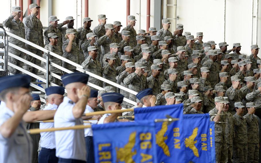 Airmen from the 86th Airlift Wing salute during the wing change-of-command ceremony at Ramstein Air Base, Germany, Thursday, Aug. 9, 2018. Brig. Gen. Mark R. August took over command from Brig. Gen. Richard G. Moore Jr.