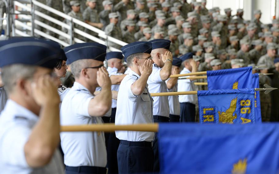 Airmen from the 86th Airlift Wing salute during the wing change-of-command ceremony at Ramstein Air Base, Germany, Thursday, Aug. 9, 2018. Brig. Gen. Mark R. August took over command from Brig. Gen. Richard G. Moore Jr.