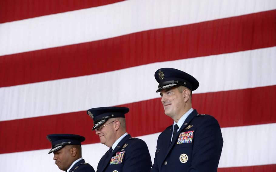 Brig. Gen. Mark R. August, right, smiles during the 86th Airlift Wing change-of-command ceremony at Ramstein Air Base, Germany, Thursday, Aug. 9, 2018. August took over command from Brig. Gen. Richard G. Moore Jr.
