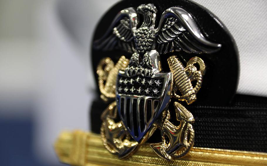 An officer's cover sits on a table aboard the aircraft carrier USS Gerald R. Ford, Feb. 3, 2018.