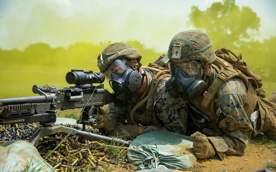 U.S. Marines with Black Sea Rotational Force don gas masks and prepare to engage targets during Exercise Platinum Lion 18 at Novo Selo Training Area, Bulgaria, Aug. 3, 2018.