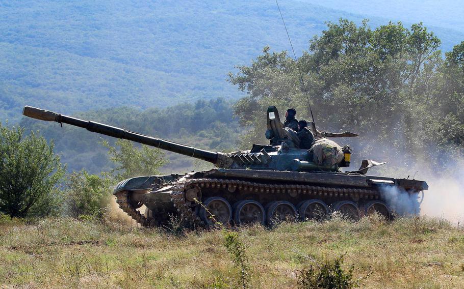 Bulgarian Soldiers maneuver their T-72 tank to higher ground during exercise Platinum Lion, an annual drill with partner nations, at Novo Selo Training Area, Bulgaria, Aug. 2, 2018.