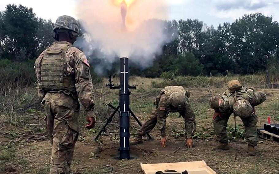Mortarmen with the 2nd Infantry Brigade Combat Team fire off mortar rounds during training in Macedonia. The training will rotate groups of mortarmen through Aug 20.