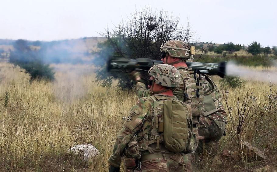 Cavalry scouts 1st Lt. Daniel D. Groleau, left, and Sgt. Guy A. Rouelle, firing, with the 61st Cavalry Regiment, fire an AT-4 rocket during an exercise at the Krivolak Training Area in Macedonia, Aug. 3, 2018.