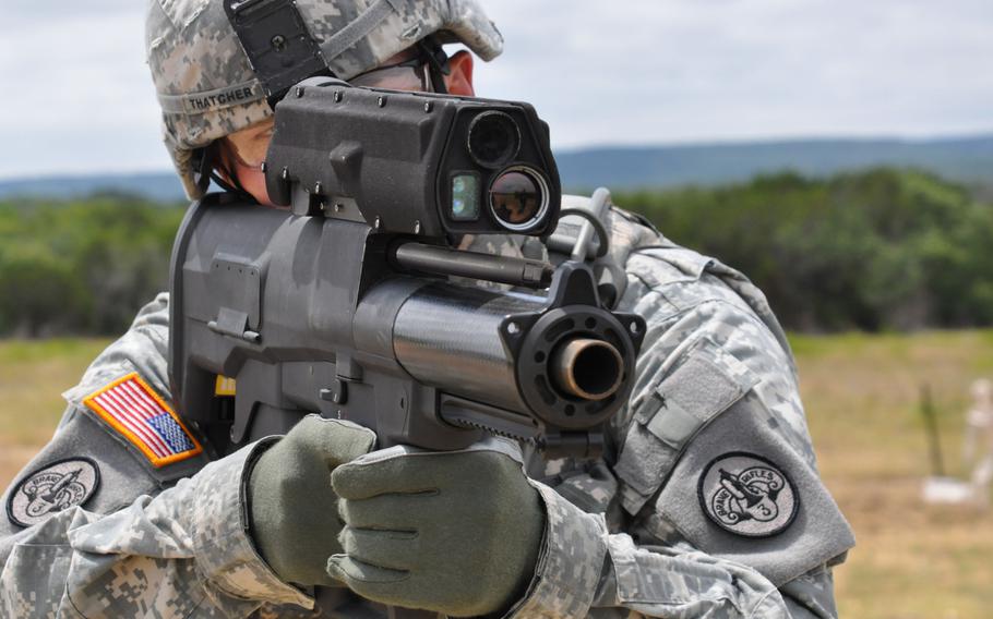 A soldier demonstrates the XM25 Counter Defilade Targeting Engagement System at Aberdeen Test Center, Md. in 2009.