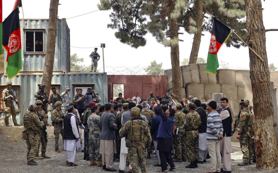 Afghan media and community members document the arrival of U.S. Army Gen. John Nicholson, Resolute Support Mission commander, during his visit to the provincial governor's compound in Kunduz Province, Afghanistan, July 5, 2018. Resolute Support released a statement Friday, Aug. 10, dismissing claims that a U.S. airstrike in Kunduz last month caused civilian casualties.