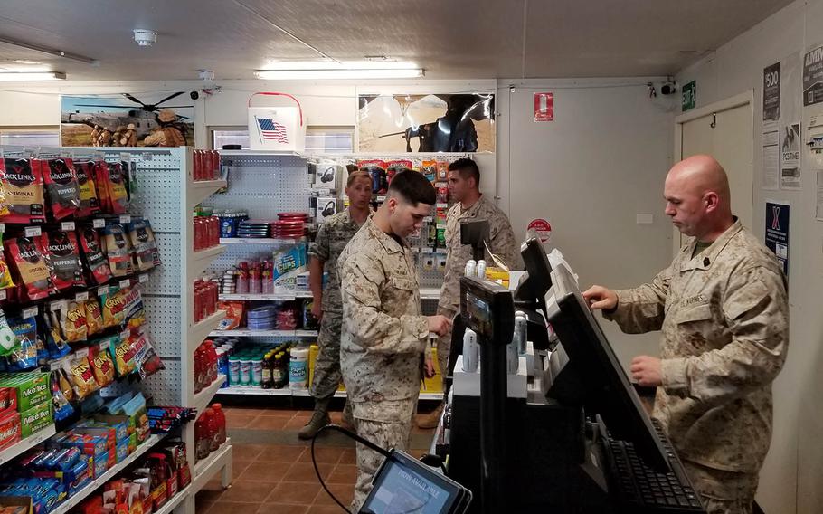 A service members checks out at the register of an AAFES store.