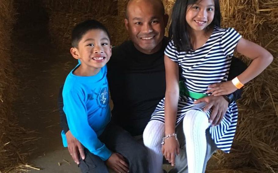 Staff Sgt. Reymund Rarogal Transfiguracion, 36, is pictured with his two children. Transfiguracion, of Waikoloa, Hawaii, died from injuries sustained when a roadside bomb detonated near him while he was on patrol in Afghanistan's Helmand province. 
                