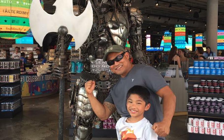 Staff Sgt. Reymund Rarogal Transfiguracion, 36, is pictured with one of his two children. Transfiguracion, from Waikoloa, Hawaii, died from injuries sustained when a roadside bomb detonated near him while he was on patrol in Afghanistan's Helmand province. 
                