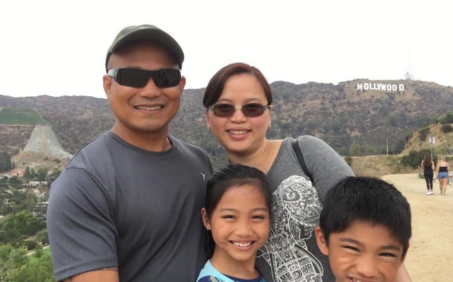 Staff Sgt. Reymund Rarogal Transfiguracion, 36, is pictured with his wife, Edelyn, and two children. Transfiguracion, of Waikoloa, Hawaii, died from injuries sustained when a roadside bomb detonated near him while he was on patrol in Afghanistan's Helmand province. 
                