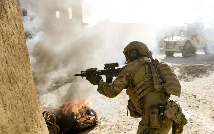 A U.S. Special Operations soldier returns fire while conducting Afghan-led offensive operations against the Taliban in Logar province, Afghanistan, on July 28, 2018. Logar borders Ghazni province, whose capital was stormed by the Taliban on Aug. 10, 2018, part of a string of attacks in the run-up to an expected cease-fire.