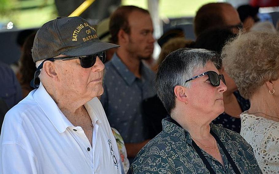 "Hellship" survivor Daniel Crowley and his wife, Kelley, attend a ceremony Wednesday, Aug. 15, 2018, at the National Memorial Cemetery of the Pacific, where a memorial stone was dedicated to 400 POWs who perished on such ships and are buried as unknowns.