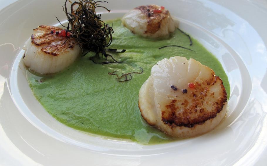 Scallops on a broccoli puree with lumpfish roe are one of several appealing appetizers offered by Arcimboldo in Sirmione, Italy, serves.