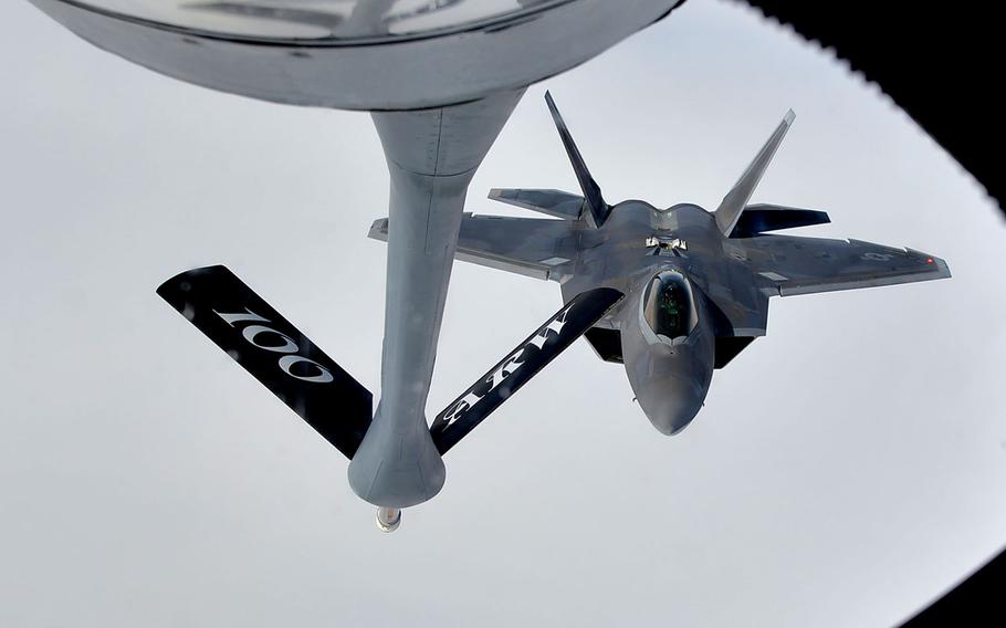 A U.S. Air Force F-22 Raptor comes in for an aerial refueling from a KC-135 Stratotanker of the RAF Mildenhall-based 100th Air Refueling Wing, over Norway, Wednesday, Aug. 15, 2018.