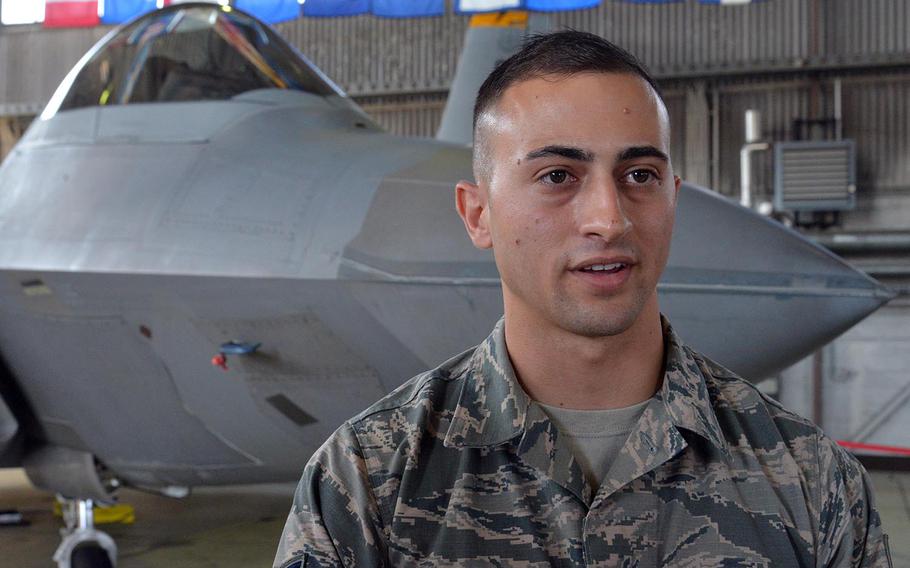 Staff Sgt. Nicholas Chaplin, a F-22 avionics technician talks about taking care of the fifth-generation aircraft while deployed. Behind him is one of the Raptors that are deployed to Spangdahlem Air Base, Germany from Tyndall Air Force Base, Florida.