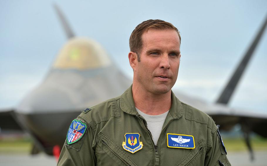 U.S. Air Force Col. Les Hauck talks to reporters at Orland Main Air Station, Norway, Wednesday, Aug. 15, 2018. Behind him is a USAF F-22 Raptor that flew in from Spangdahlem Air Base, Germany.