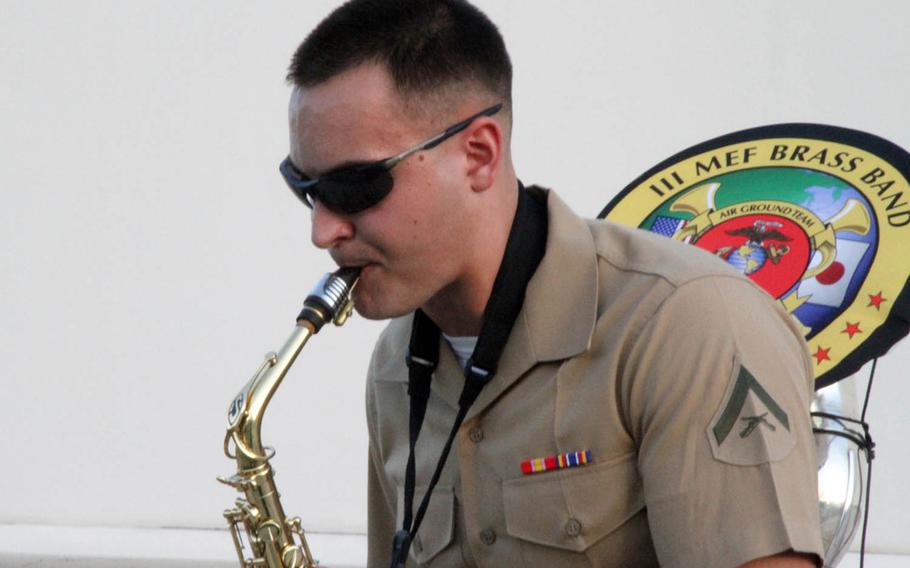Lance Cpl. Alex Ilgenfritz of the Okinawa-based III Marine Expeditionary Force brass band belts out a solo last month during a performance on Guam.