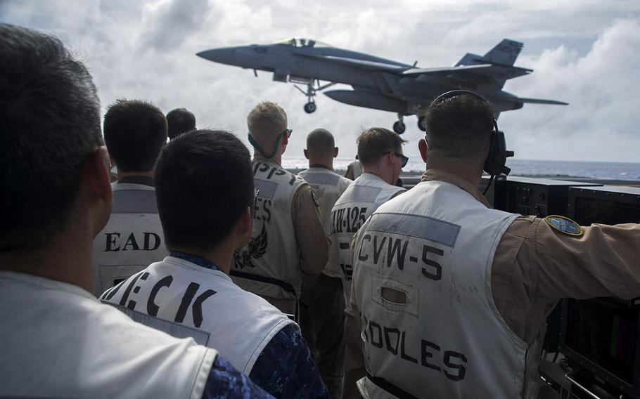 An F/A-18E Super Hornet assigned to the "Dambusters" of Strike Fighter Squadron 195 lands on the aircraft carrier USS Ronald Reagan, Wednesday, Aug. 15, 2018.