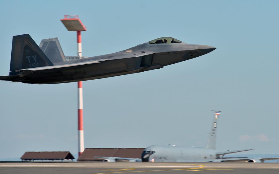 A U.S. Air Force F-22 Raptor passes a KC-135 Stratotanker as it takes off from Spangdahlem Air Base, Germany, Thursday, Aug. 16, 2018. The jet, from the 95th Fighter Squadron out of Tyndall Air Force Base, Fla., is one of 13 deployed to Europe for training.