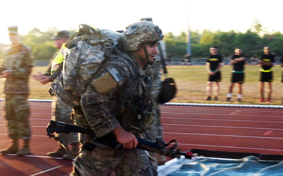 Staff Sgt. Luis Saucedo finishes the foot-march portion of the 2018 U.S. Army Europe Best Warrior Competition, Friday, Aug. 17, 2018, at Grafenwoehr, Germany.