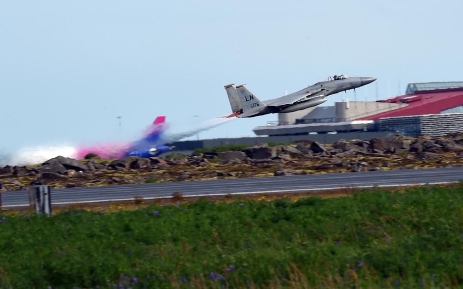 An F-15C fighter jet takes off during one of the U.S. Air Force's mock scrambles during an Iceland Air Surveillance mission at Keflavik, Iceland, Wednesday, Aug. 15, 2018.