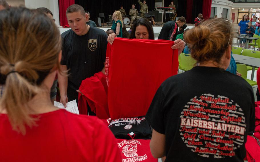 Students and parents check out the new school T-shirts during an open house at the new Kaiserslautern High School, Friday, Aug. 24, 2018. Classes begin at the school on Monday, Aug. 27.