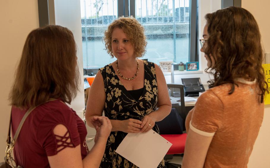 Eleventh-grade counselor Jill Straka talks with a parent and student during an open house at the new Kaiserslautern High School, Friday, Aug. 24, 2018. Classes begin at the school on Monday, Aug. 27.