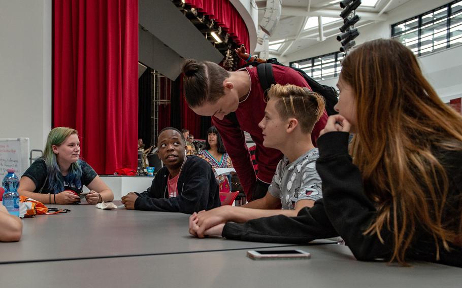 Students reconnect during an open house at the new Kaiserslautern High School, Friday, Aug. 24, 2018. Classes begin at the school on Monday, Aug. 27, 2018.