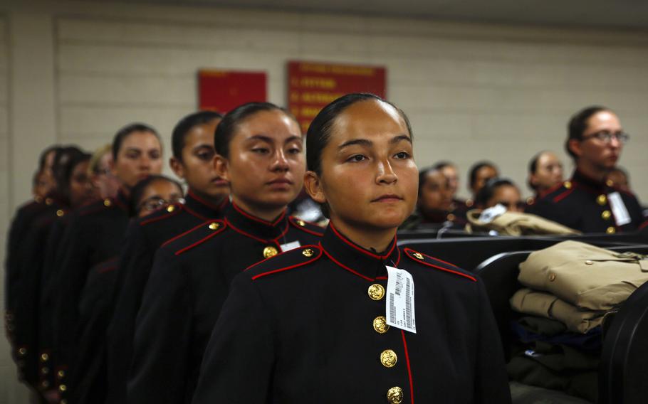 Recruits with Platoon 4040, Papa Company, 4th Recruit Training Battalion, try on their blue dress coats for the first time Aug. 21, 2018, on Parris Island S.C. The recruits are part of the first female company to be issued the new female blue dress coat, which features a mandarin collar.