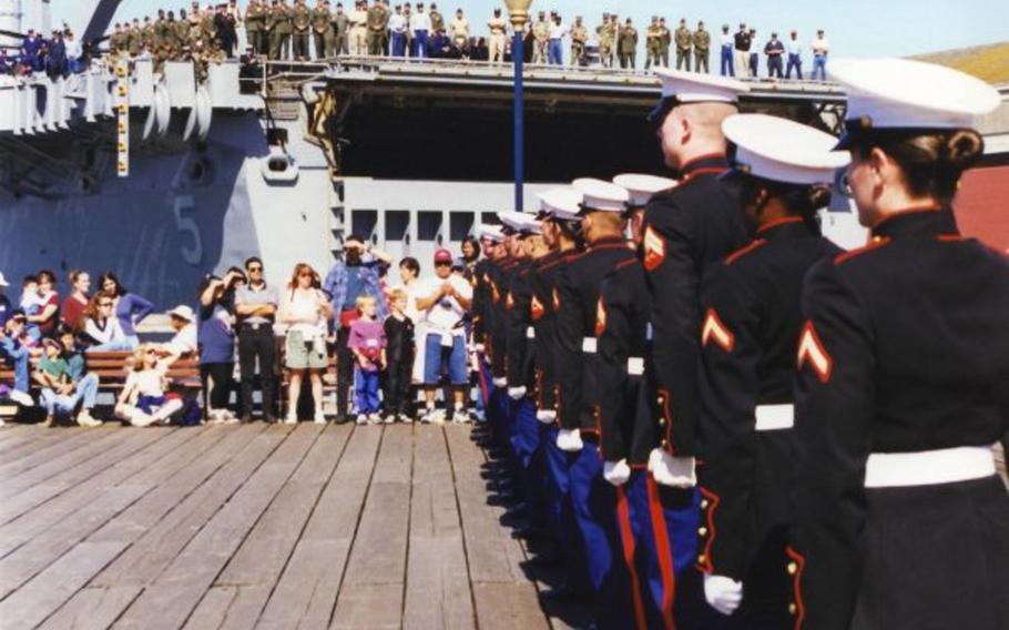 Pictured here during a performance at San Francisco's Fleet Week on Saturday, Oct. 10, 1998, are Marines of the silent drill team from Marine Corps Detachment, Defense Language Institute, Presidio of Monterey, Calif. The female Marines on the team were authorized to wear specially tailored male dress blues coats.