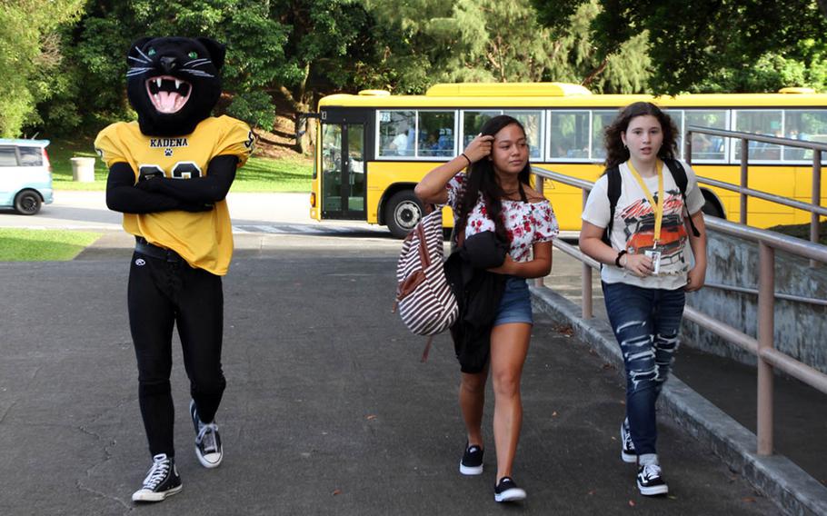 The Kadena High School mascot greets students arriving for the first day of classes in Okinawa, Japan, Monday, Aug. 27, 2018.