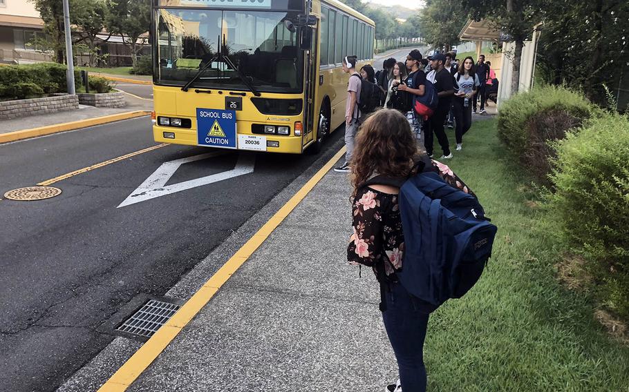 Marissa Fowler, 17, waits for the school bus in the Ikego housing area near Yokosuka Naval Base, Japan, Monday, Aug. 27, 2017.