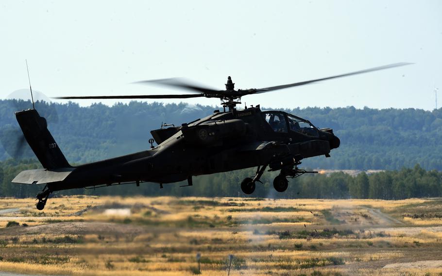 An Army AH-64D Apache helicopter fires 30mm training rounds during the 6th Squadron, 17th Cavalry Regiment's first gunnery training since they arrived in Europe to support Operation Atlantic Resolve, at Grafenwoehr, Germany, Wednesday, Aug. 29, 2018.