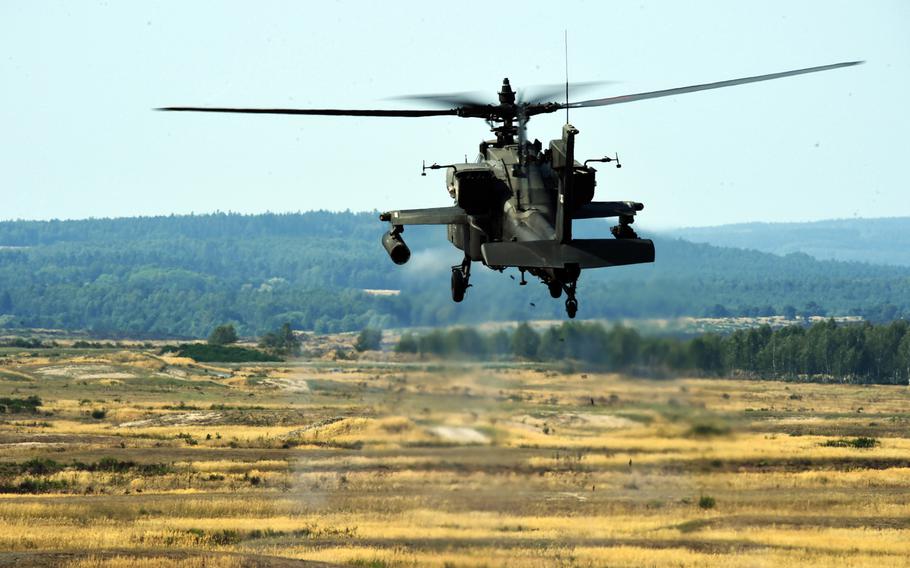 An Army AH-64D Apache helicopter fires 30mm training rounds during the 6th Squadron, 17th Cavalry Regiment's first gunnery training since they arrived in Europe to support Operation Atlantic Resolve, at Grafenwoehr, Germany, Wednesday, Aug. 29, 2018.