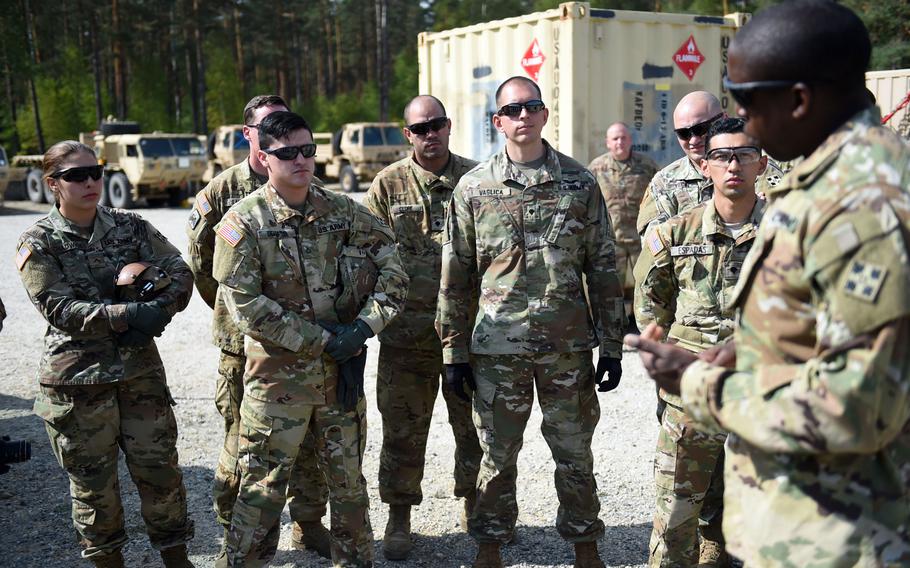 Soldiers with the 6th Squadron, 17th Cavalry Regiment, 4th Combat Aviation Brigade, listen to instructions from Staff Sgt. Michael Adeyanju, an Apache helicopter electrician, during the squadron's first gunnery training since they arrived in Europe to support Operation Atlantic Resolve, at Grafenwoehr, Germany, Wednesday, Aug. 29, 2018.