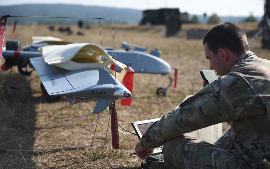Pfc. Elijah Bova, an unmanned aerial vehicle maintainer with the 173rd Brigade Combat Team (Airborne), checks the software on an RQ-7 Shadow drone, at Grafenwoehr, Germany, Wednesday, Aug. 29, 2018.