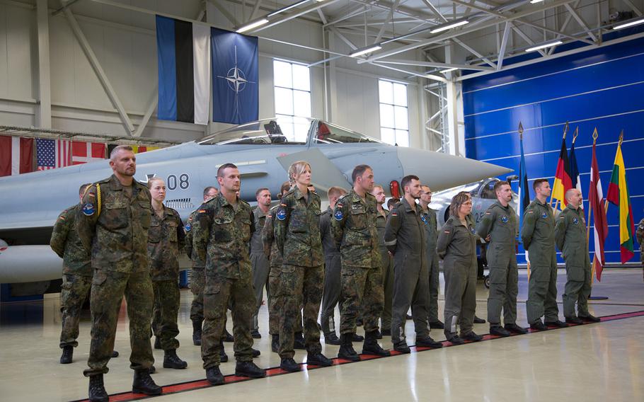 The German air force's Baltic air-policing detachment stands in front of a Typhoon Eurofighter during a ceremony at Amari Air Base, Estonia, Thursday, Aug. 30, 2018.